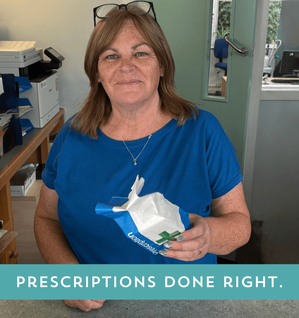 Debra one of our friendly Pharmacy Dispensers smiling whilst holding an NHS Prescription. There is a caption saying 'Prescriptions Done Right'.
