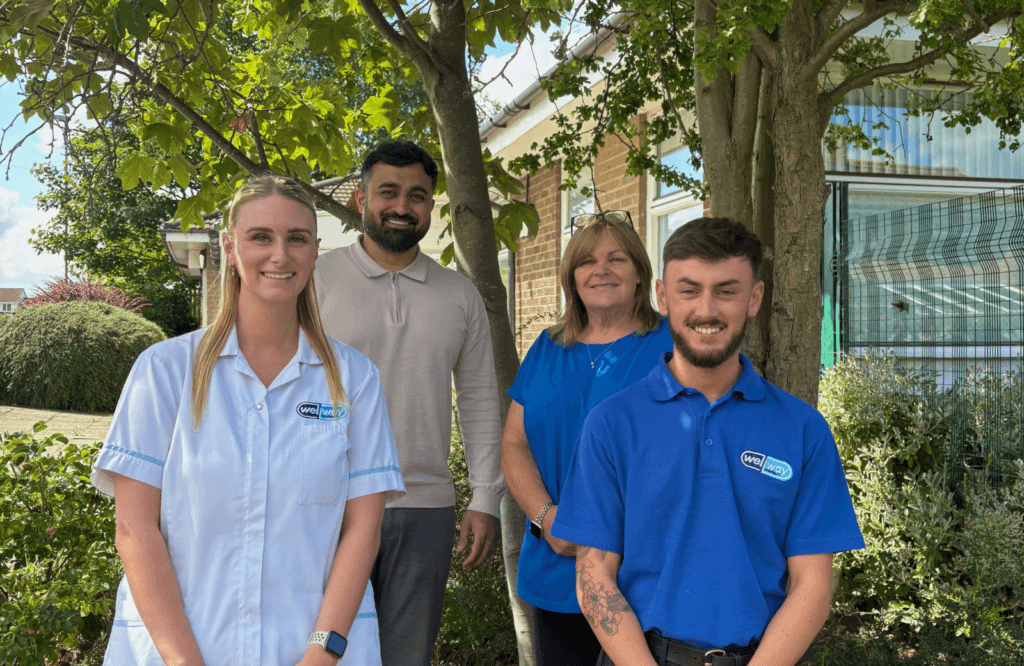 The Pegswood pharmacy team smiling outside Pegswood Surgery.