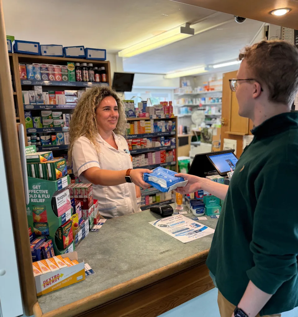 Rafaela our Pharmacy Supervisor handing out a prescription to a patient at our Morpeth Pharmacy.